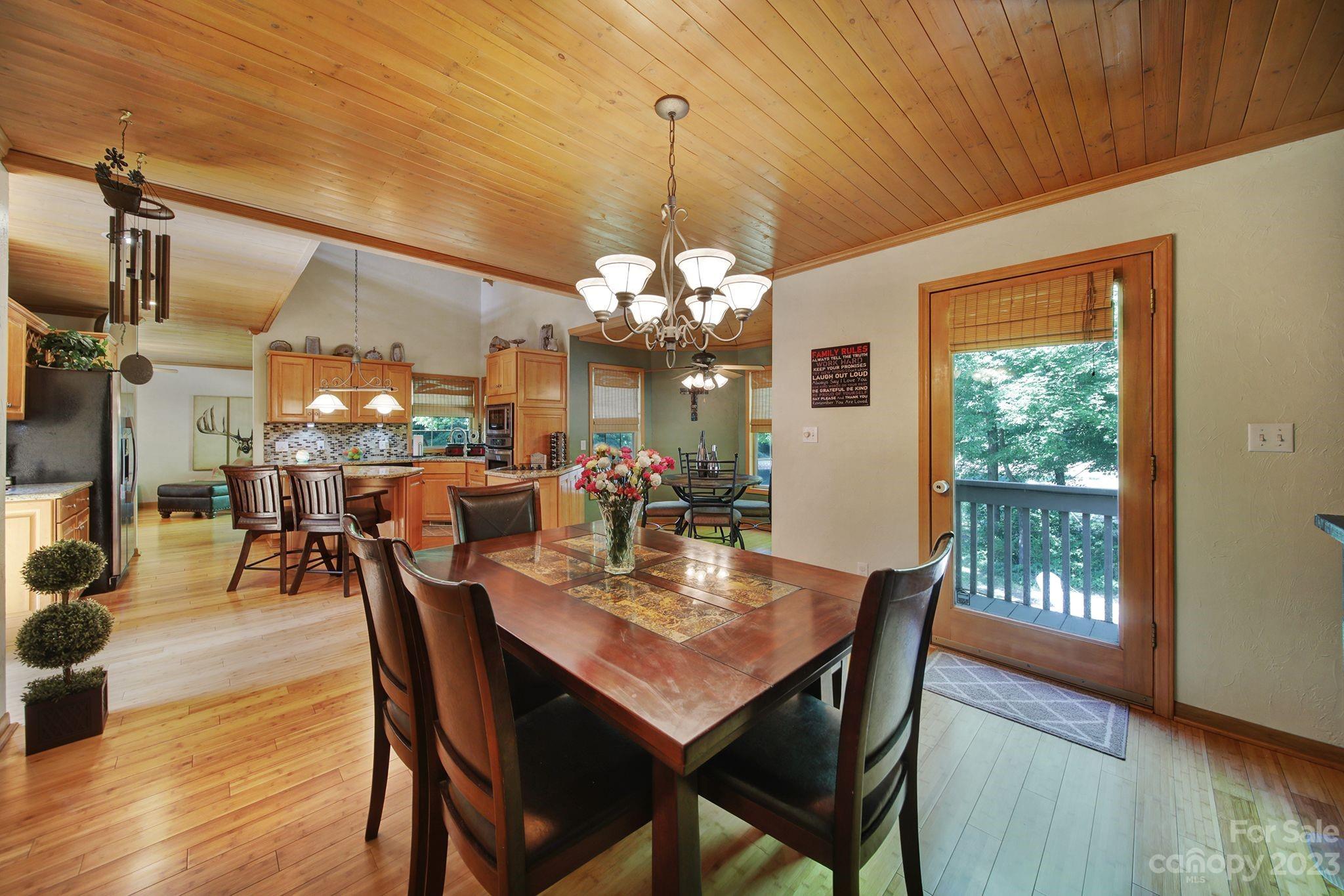 332 Boggs Road Thomasville, NC 27360 - Photo 10 of 41 a view of a dining room with furniture window and wooden floor