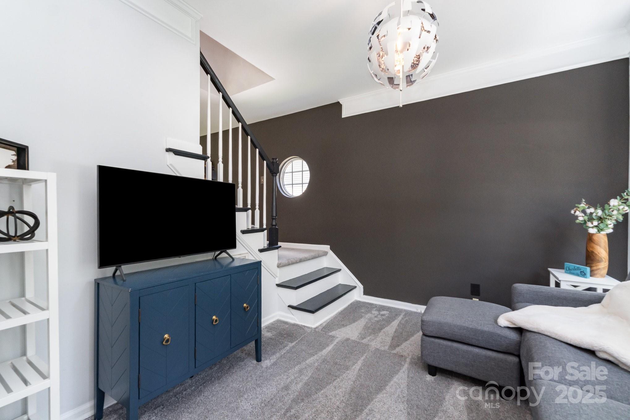11624 Crossroads Place Concord, NC 28025 - Photo 15 of 45 a living room with furniture and a flat screen tv