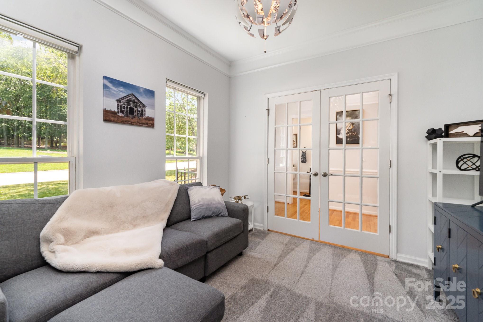 11624 Crossroads Place Concord, NC 28025 - Photo 16 of 45 a living room with furniture and a large window