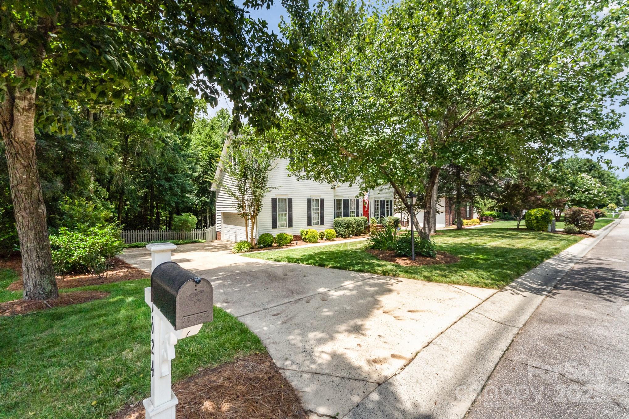11624 Crossroads Place Concord, NC 28025 - Photo 2 of 45 a view of a house with a yard