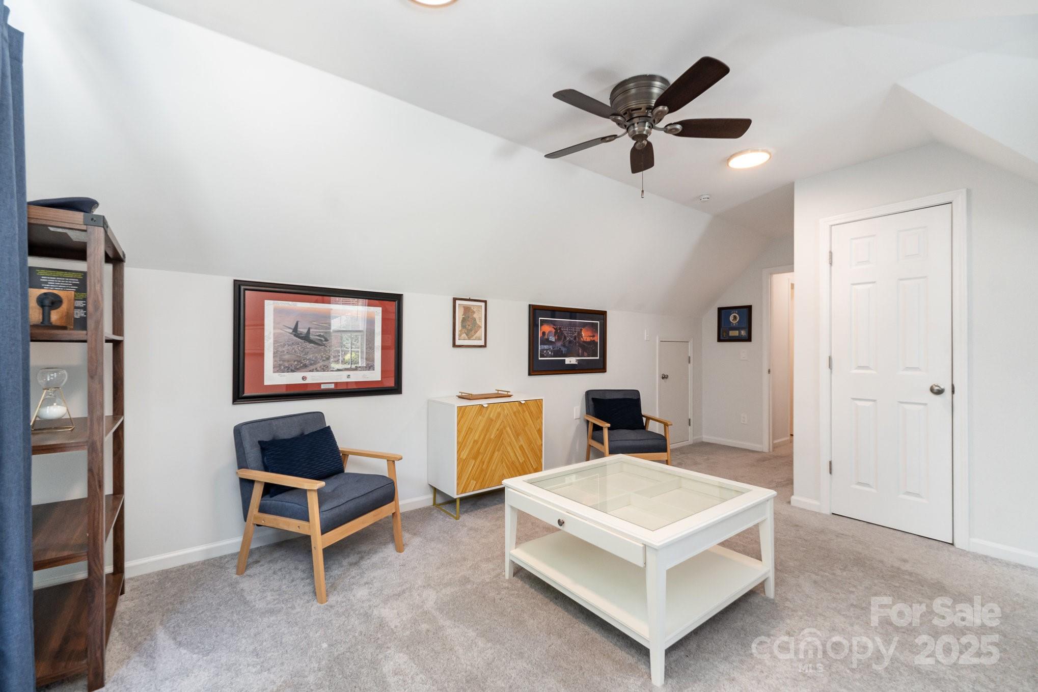 11624 Crossroads Place Concord, NC 28025 - Photo 29 of 45 a living room with furniture and a ceiling fan
