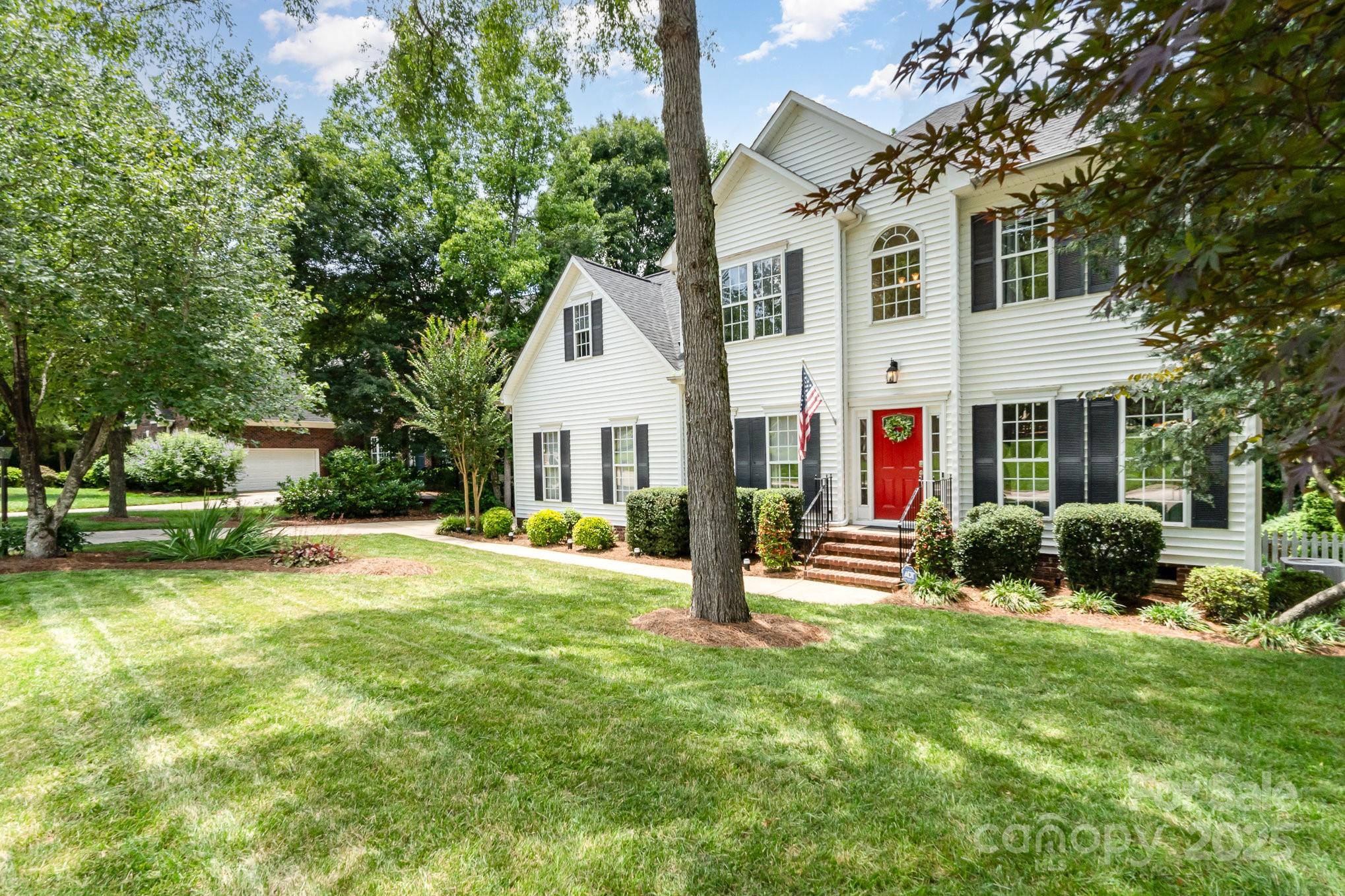 11624 Crossroads Place Concord, NC 28025 - Photo 3 of 45 a view of a house with a yard patio and fire pit