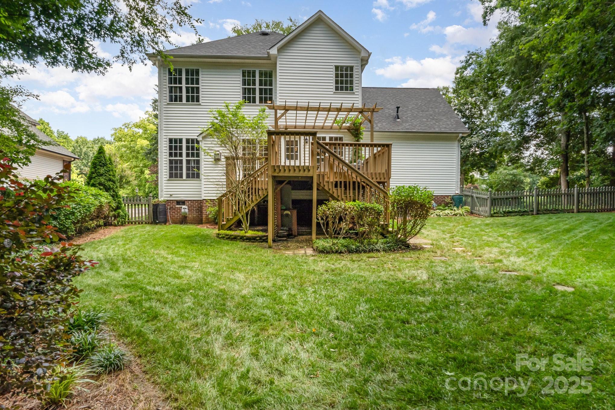 11624 Crossroads Place Concord, NC 28025 - Photo 37 of 45 a view of a house with backyard and garden