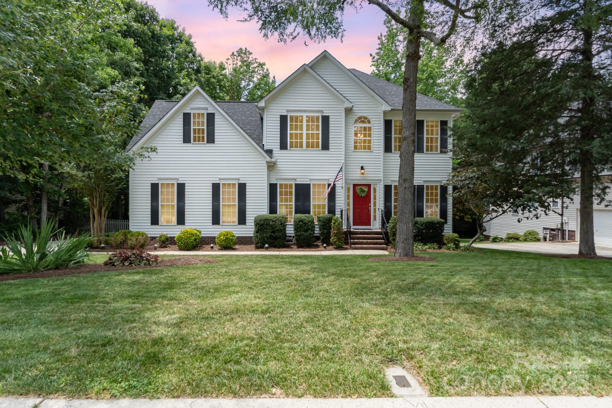 11624 Crossroads Place Concord, NC 28025 - Photo 43 of 45 a front view of a house with a yard