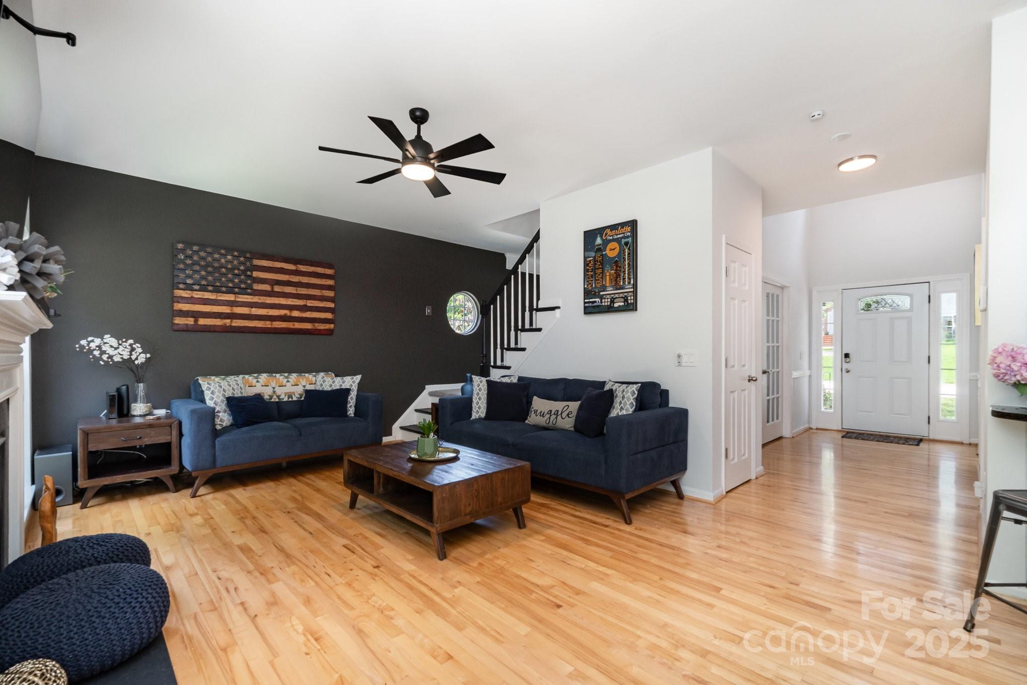 11624 Crossroads Place Concord, NC 28025 - Photo 5 of 45 a living room with furniture and a wooden floor