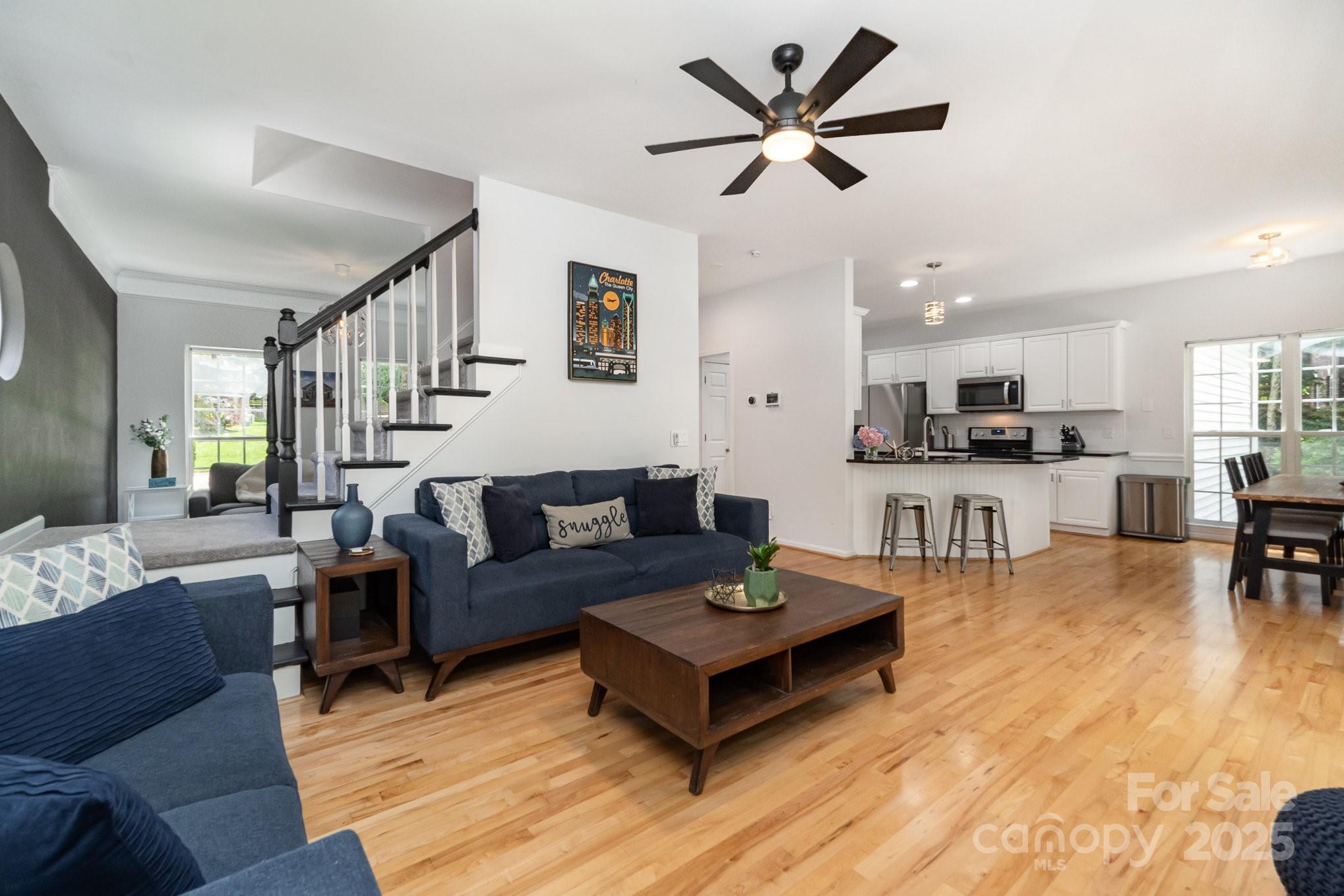 11624 Crossroads Place Concord, NC 28025 - Photo 7 of 45 a living room with furniture and kitchen view