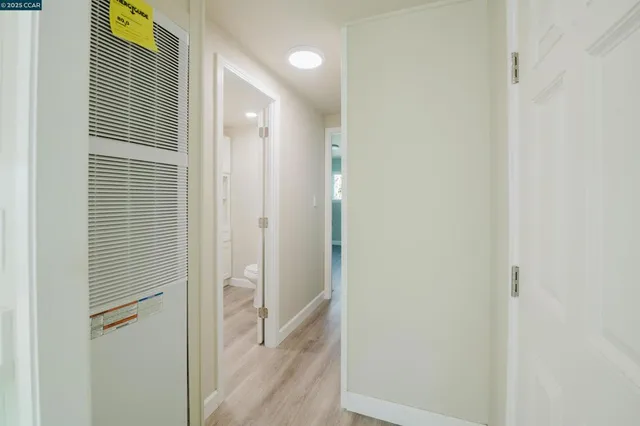 a bathroom with a shower and a glass door