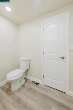 a white toilet sitting next to a bathroom sink