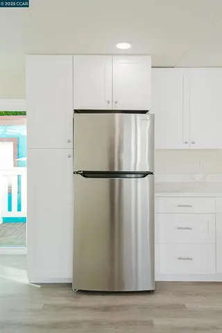 a view of a refrigerator in a kitchen