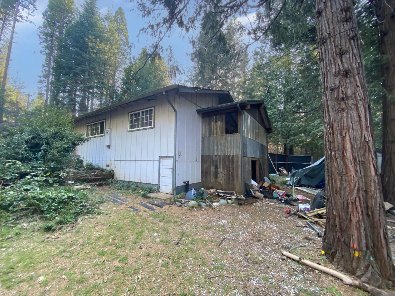 33740 Nary Red Road Alta, CA 95701 - Photo 1 of 1 a backyard of a house with barbeque oven and outdoor seating