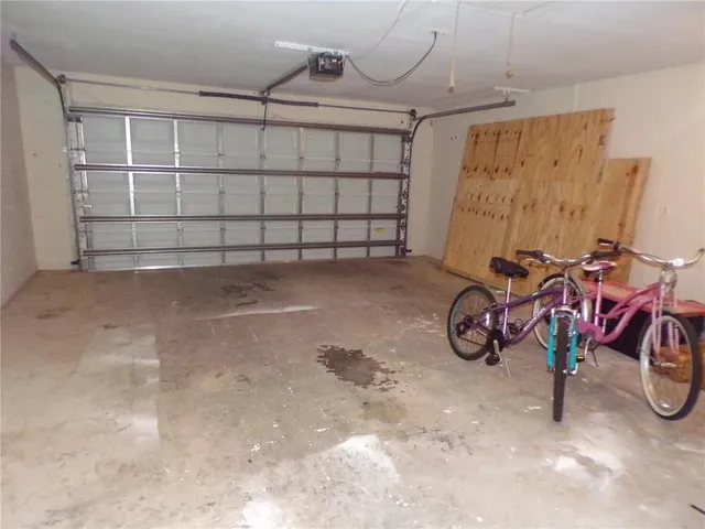a view of a garage with parked cars