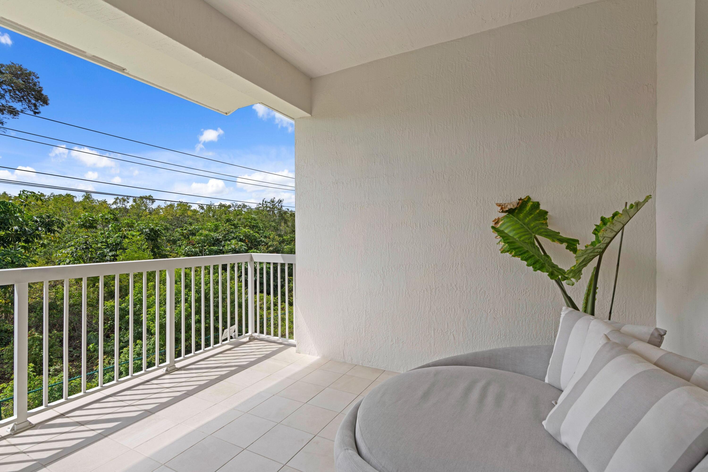 100 Northwest 69th Circle, Unit 82 Boca Raton, FL 33487 - Photo 12 of 42 a view of a balcony with furniture