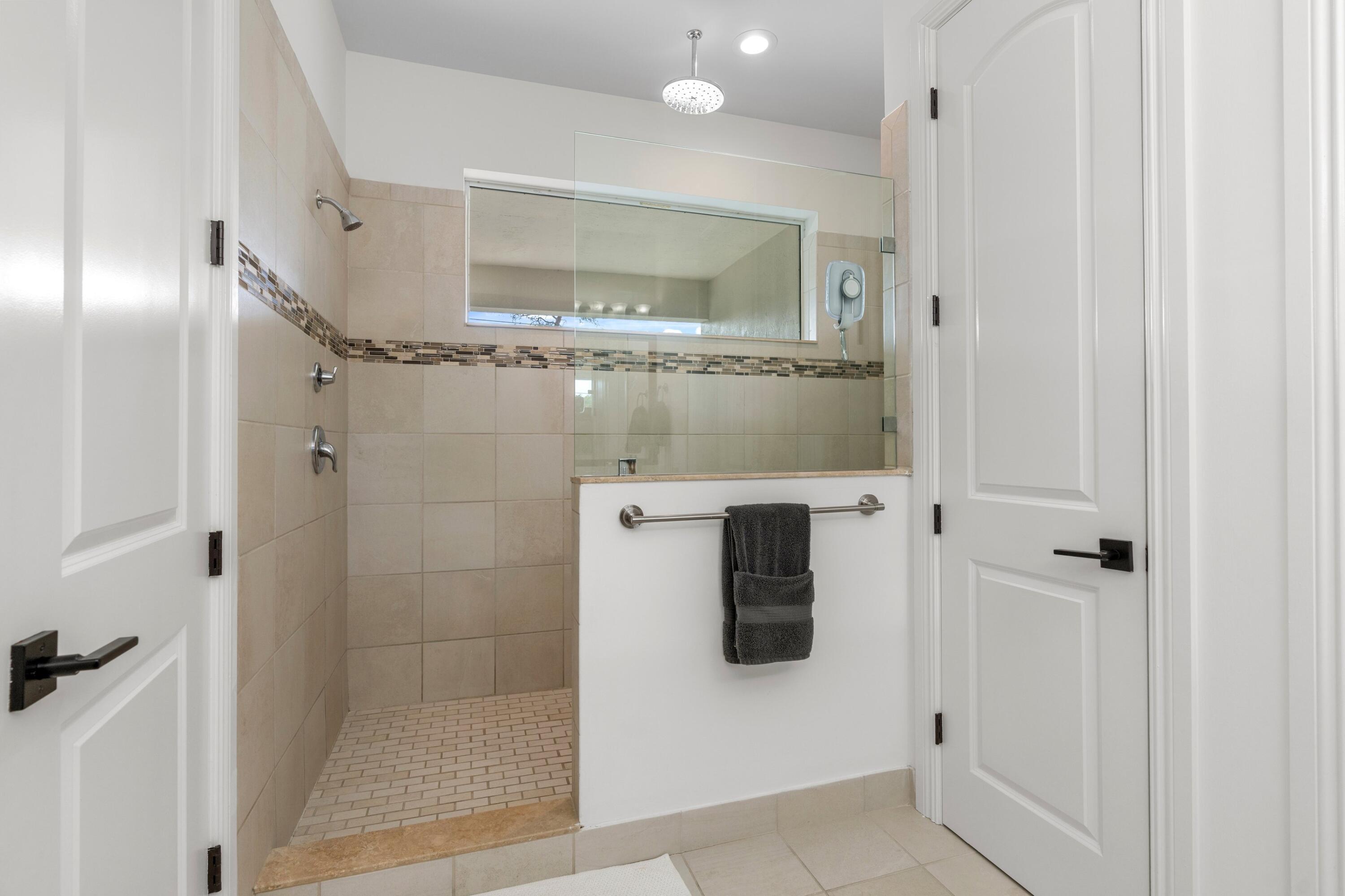 100 Northwest 69th Circle, Unit 82 Boca Raton, FL 33487 - Photo 14 of 42 a bathroom with a shower and a sink