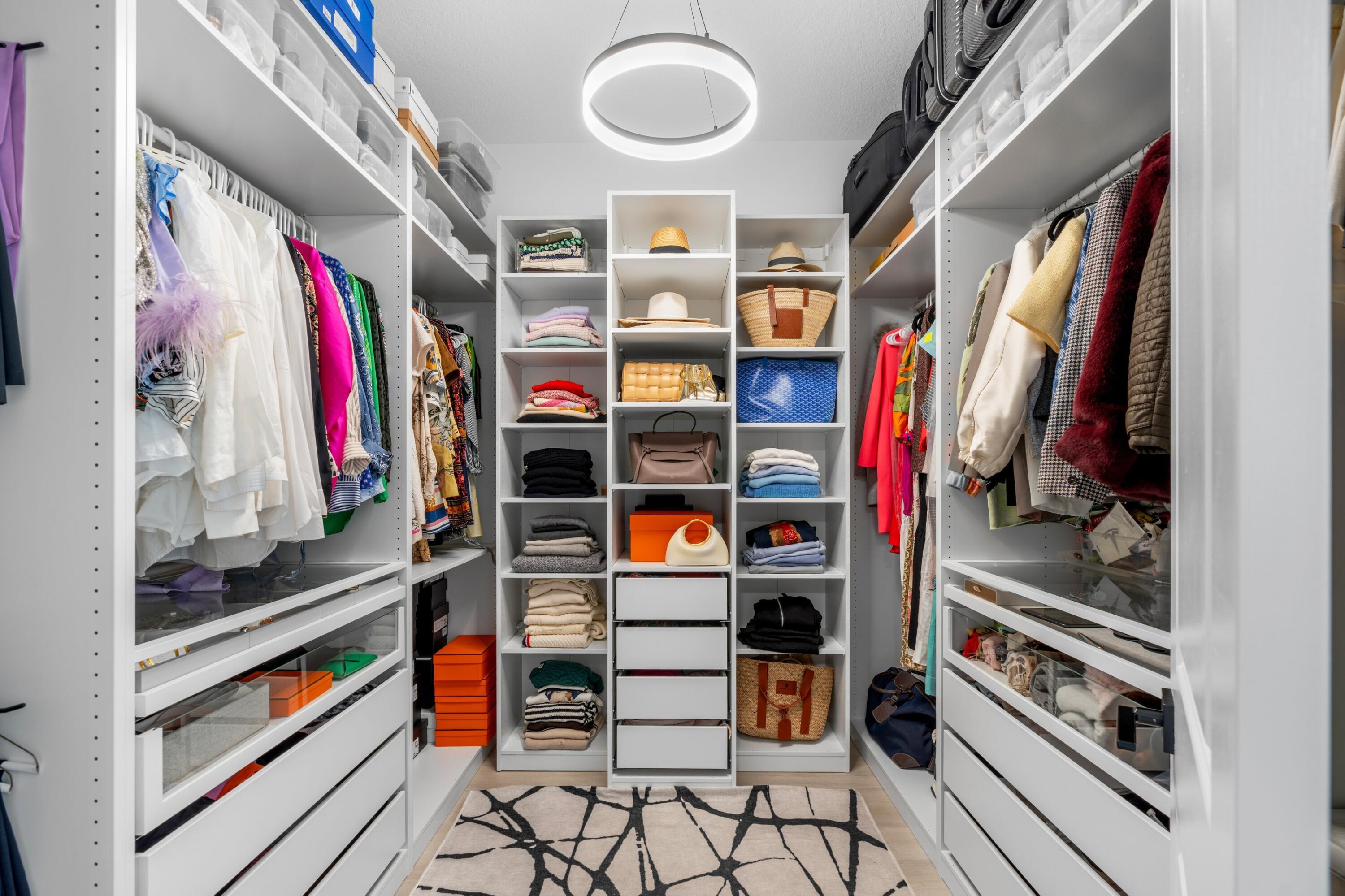 100 Northwest 69th Circle, Unit 82 Boca Raton, FL 33487 - Photo 15 of 42 a view of walk in closet with clothes and shoes