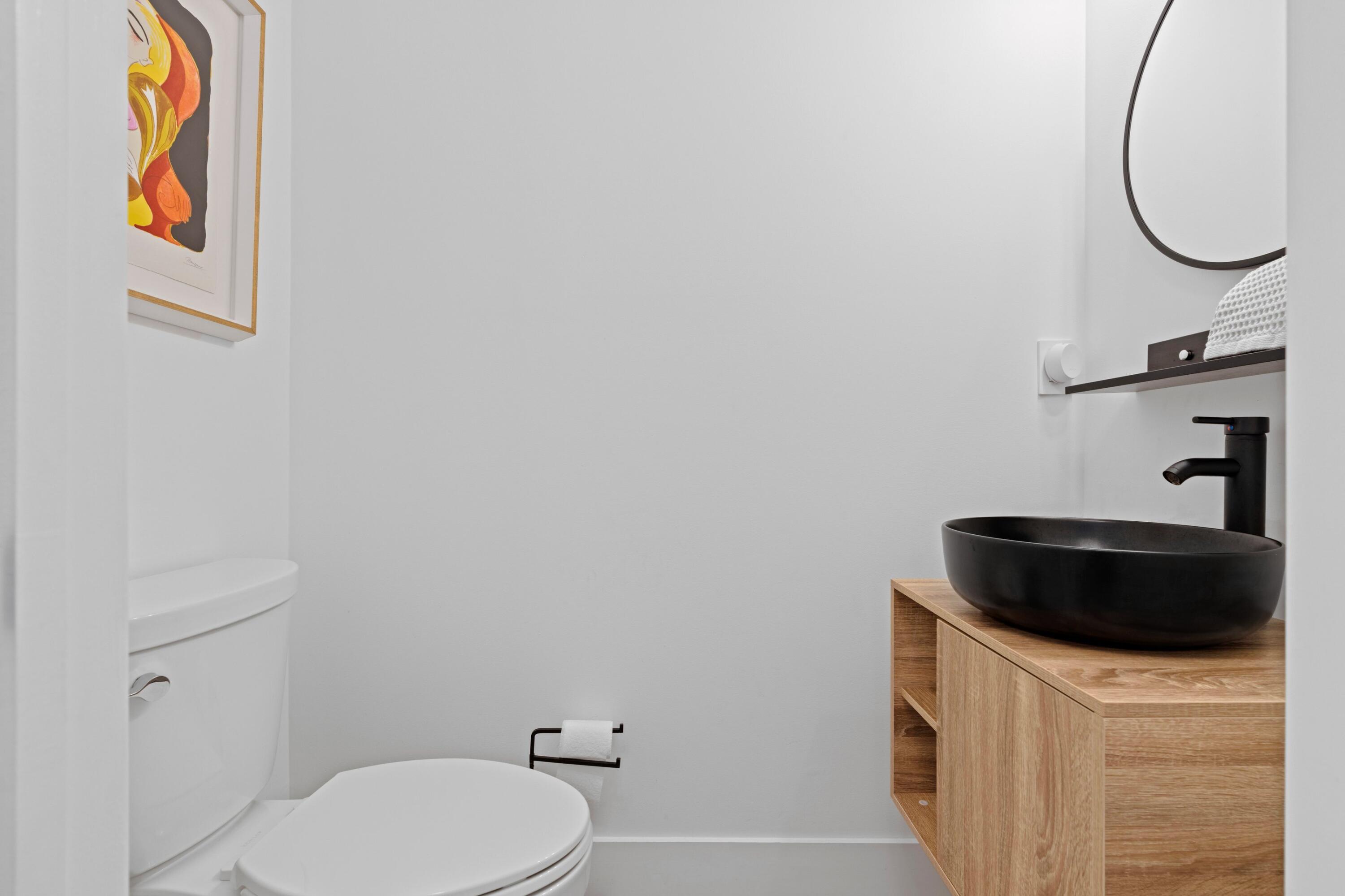 100 Northwest 69th Circle, Unit 82 Boca Raton, FL 33487 - Photo 20 of 42 a bathroom with a toilet and a mirror