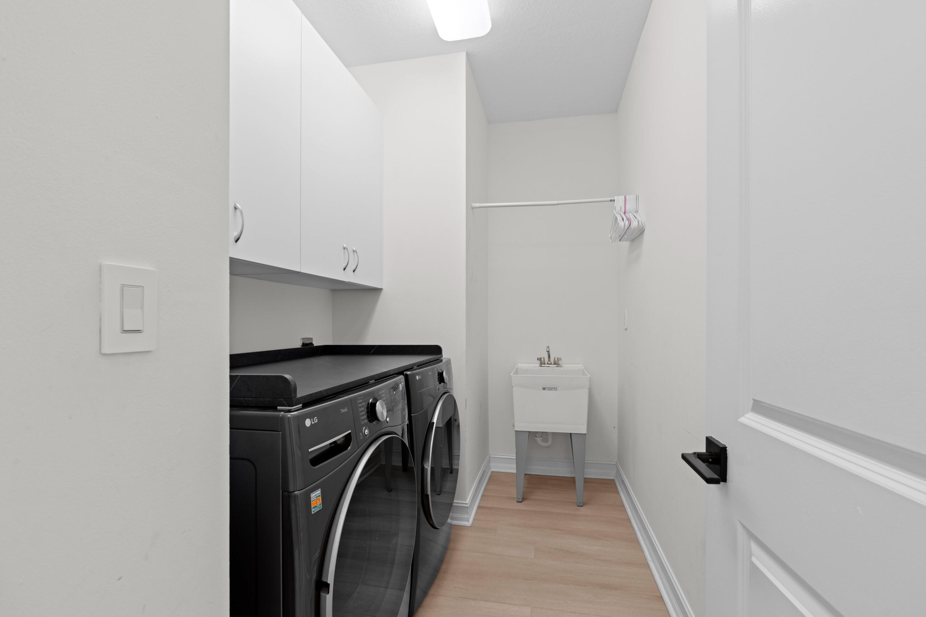 100 Northwest 69th Circle, Unit 82 Boca Raton, FL 33487 - Photo 22 of 42 a view of a storage and utility room with washer and dryer