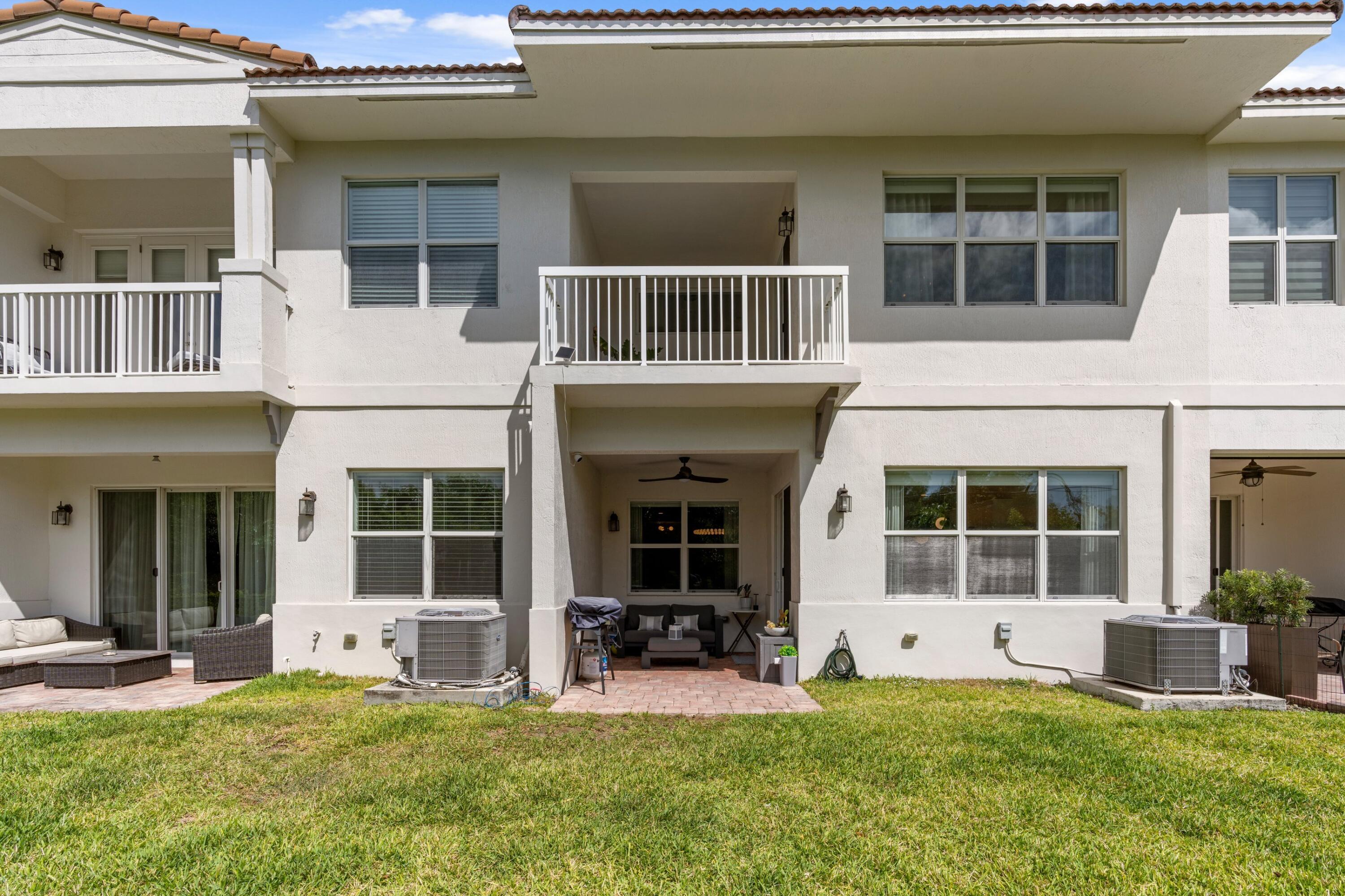 100 Northwest 69th Circle, Unit 82 Boca Raton, FL 33487 - Photo 24 of 42 a house view with a sitting space and garden space