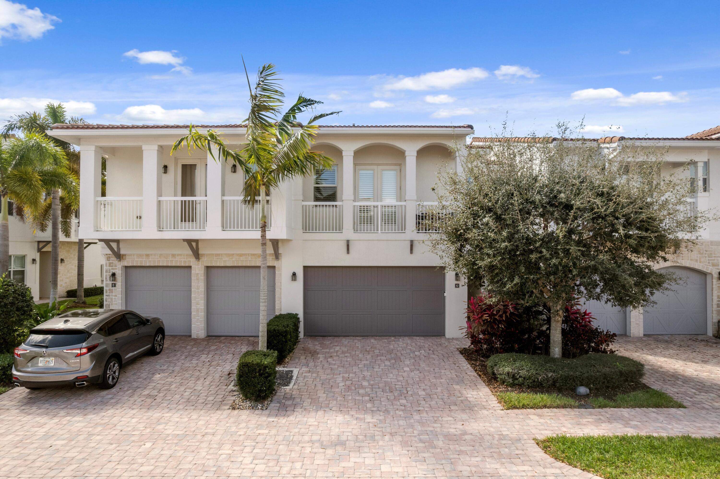 100 Northwest 69th Circle, Unit 82 Boca Raton, FL 33487 - Photo 25 of 42 a front view of a house with garden
