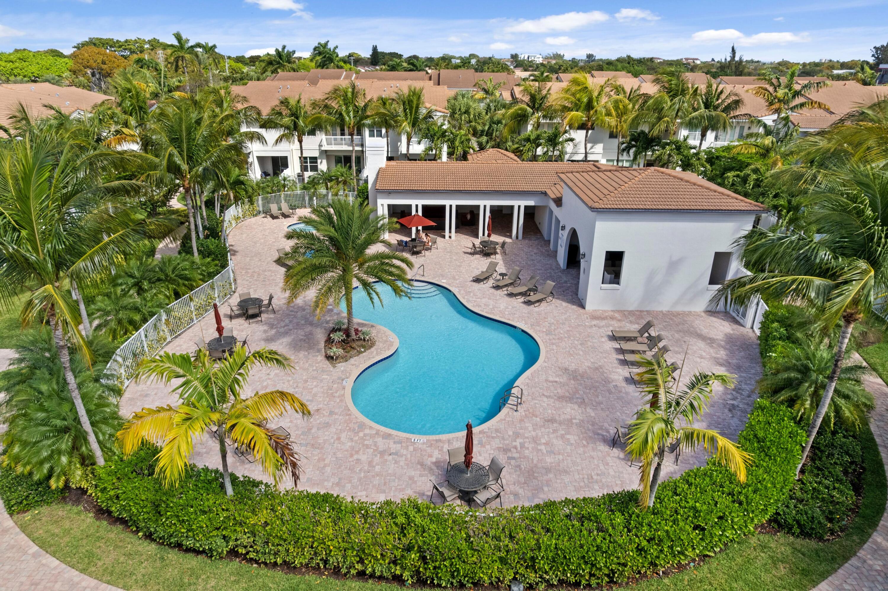 100 Northwest 69th Circle, Unit 82 Boca Raton, FL 33487 - Photo 26 of 42 an aerial view of a house with a garden and trees