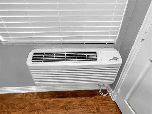 an empty room with a empty space and windows