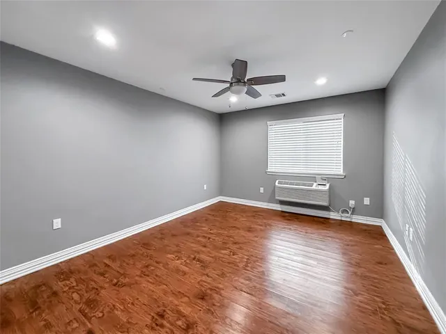 a view of gallery with wooden floor