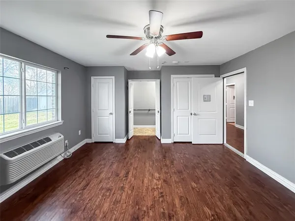 a balcony with table and chairs