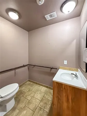 a bathroom with a glass shower door