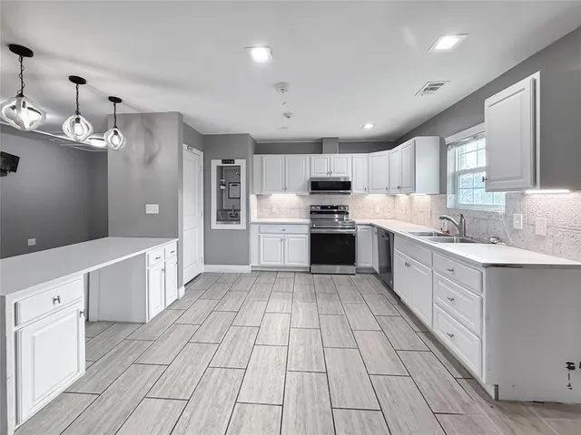 a large kitchen with cabinets