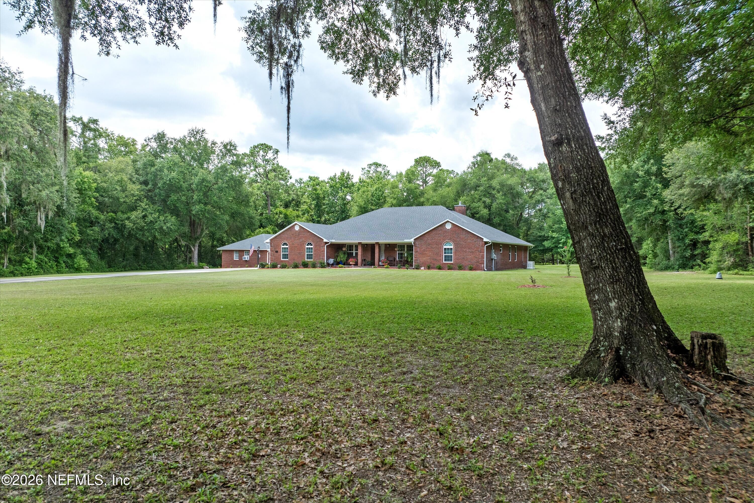 5566 Don Manuel Road Elkton, FL 32033 - Photo 3 of 47 a view of a house with a yard