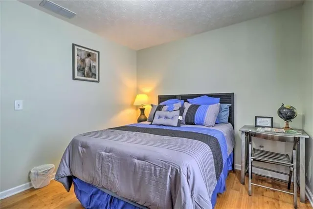 a bedroom with a bed and a closet