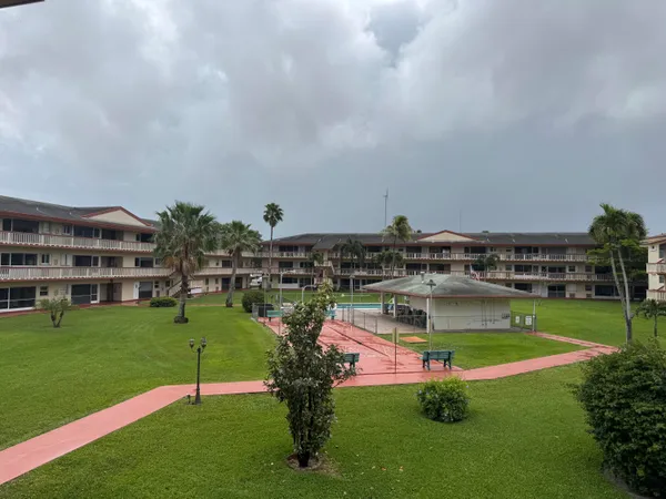 a view of a swimming pool and a yard