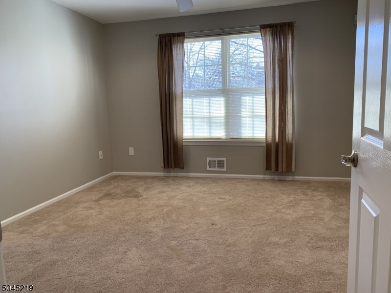 13 Potomac Drive, Unit 13 Bernards, NJ 07920 - Photo 13 of 16 a view of an empty room with a window