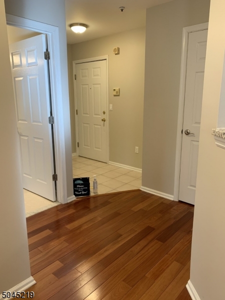 13 Potomac Drive, Unit 13 Bernards, NJ 07920 - Photo 15 of 16 a view of empty room with wooden floor