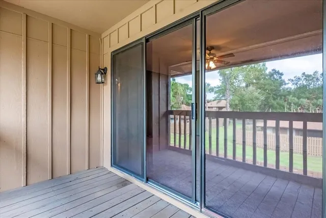 a view of a balcony with wooden floor