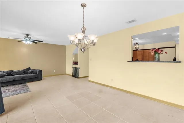 a view of a livingroom with furniture and a chandelier