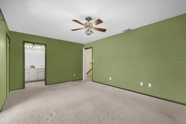 a view of a big room with windows