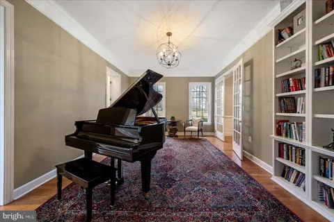 a view of hallway with wooden floor