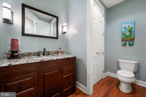 a bedroom with furniture and a large window