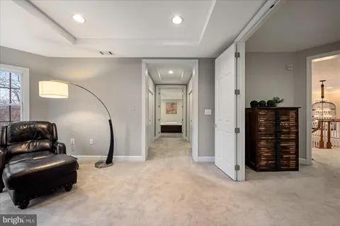 a view of room with stairs and wooden floor