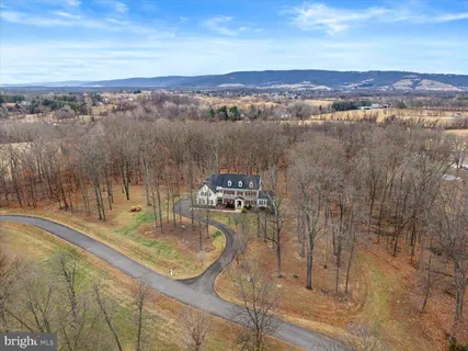 a view of living room kitchen with granite countertop furniture and a fireplace