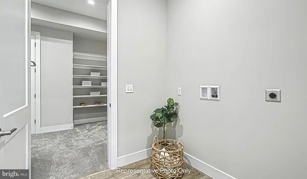 a view of entryway with wooden floor