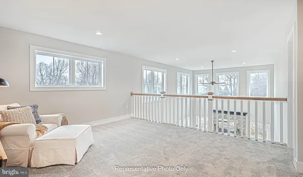 a living room with furniture and windows
