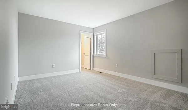 a view of an empty room with window