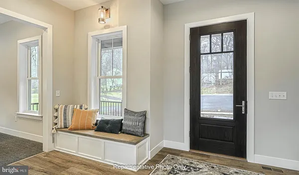 a living room with furniture and windows