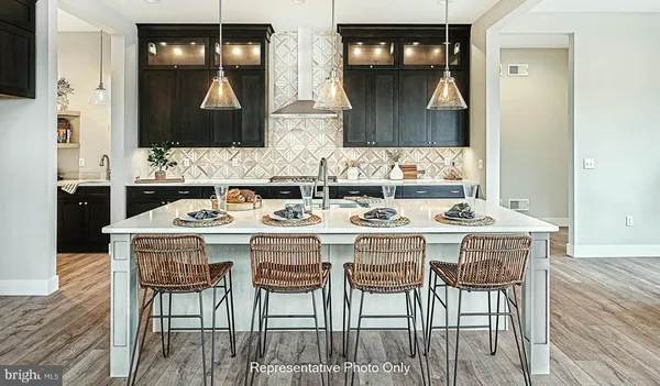 a kitchen with a dining table and chairs