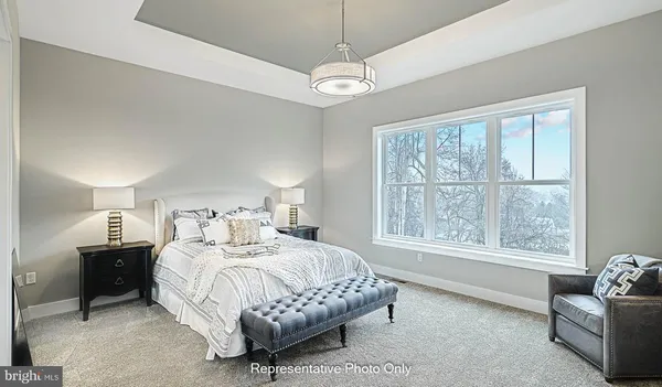a bedroom with a bed and a couch