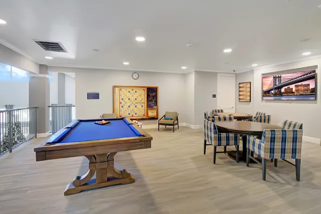 a room with furniture and pool table
