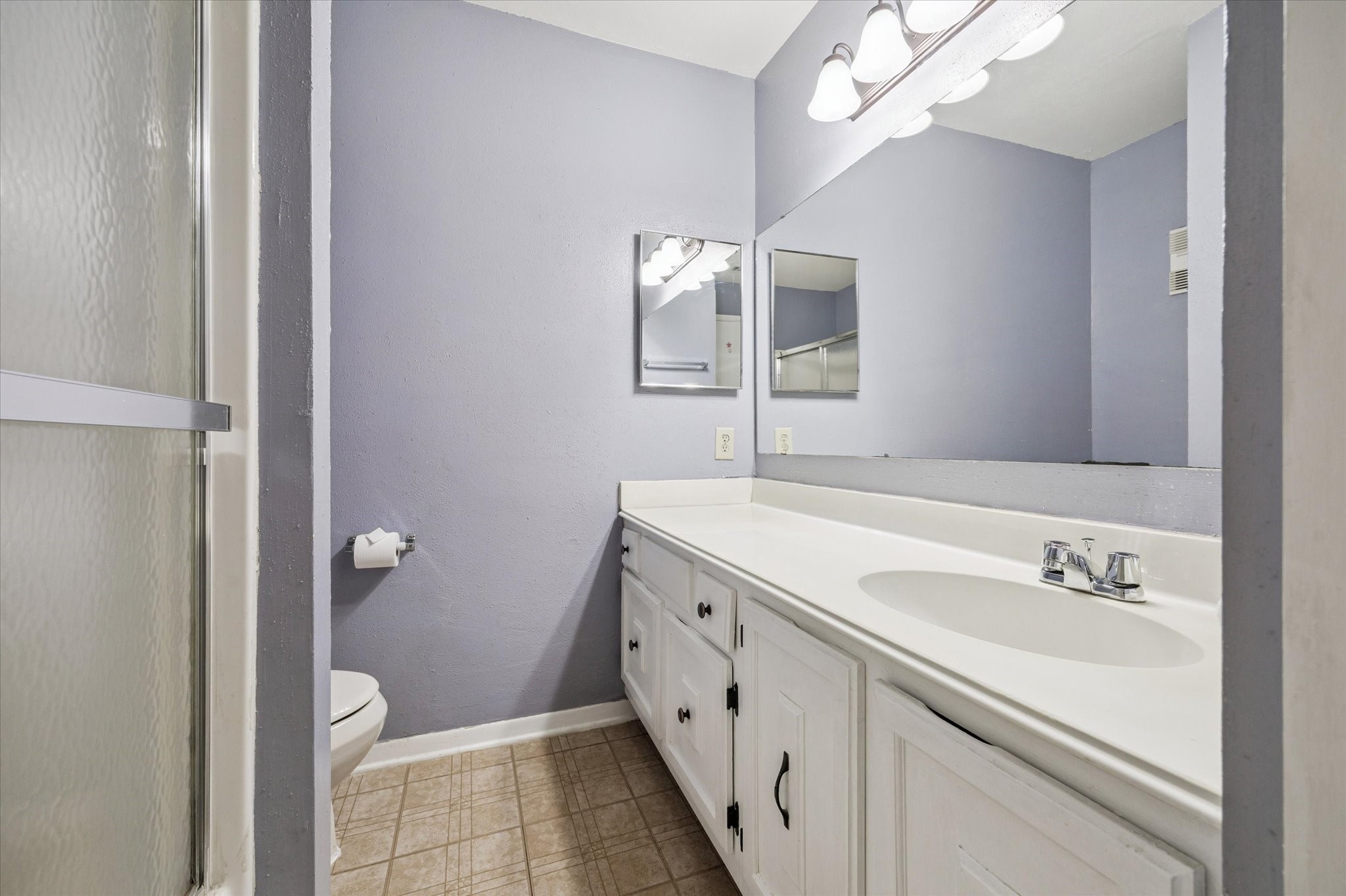 6517 Wanda Lane Houston, TX 77074 - Photo 19 of 36 The hall bathroom has a large vanity with good storage, a tub/shower combo, and updated lighting.