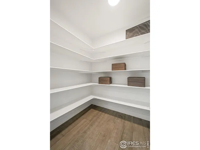 a view of washer and dryer with kitchen in the background