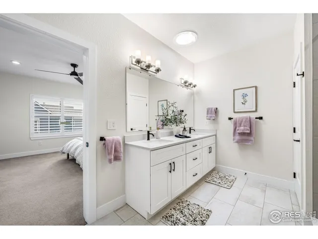 a bathroom with a sink vanity tub and shower